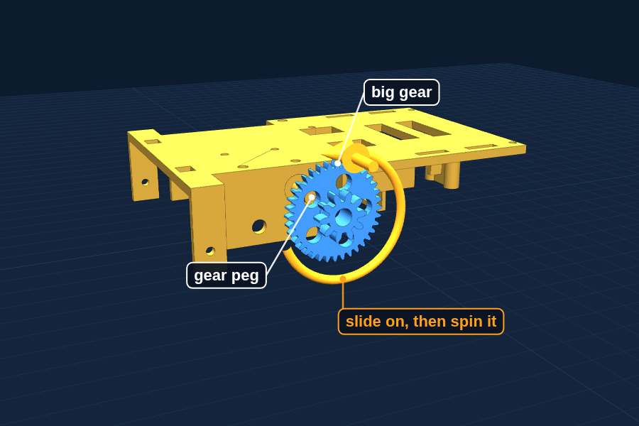 Slide the big gear onto the gear peg on the base and spin it.